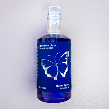 Underground Spirits  Palliative Care ACT 40th Anniversary Gin bottle featuring butterfly design with deep blue butterfly pea